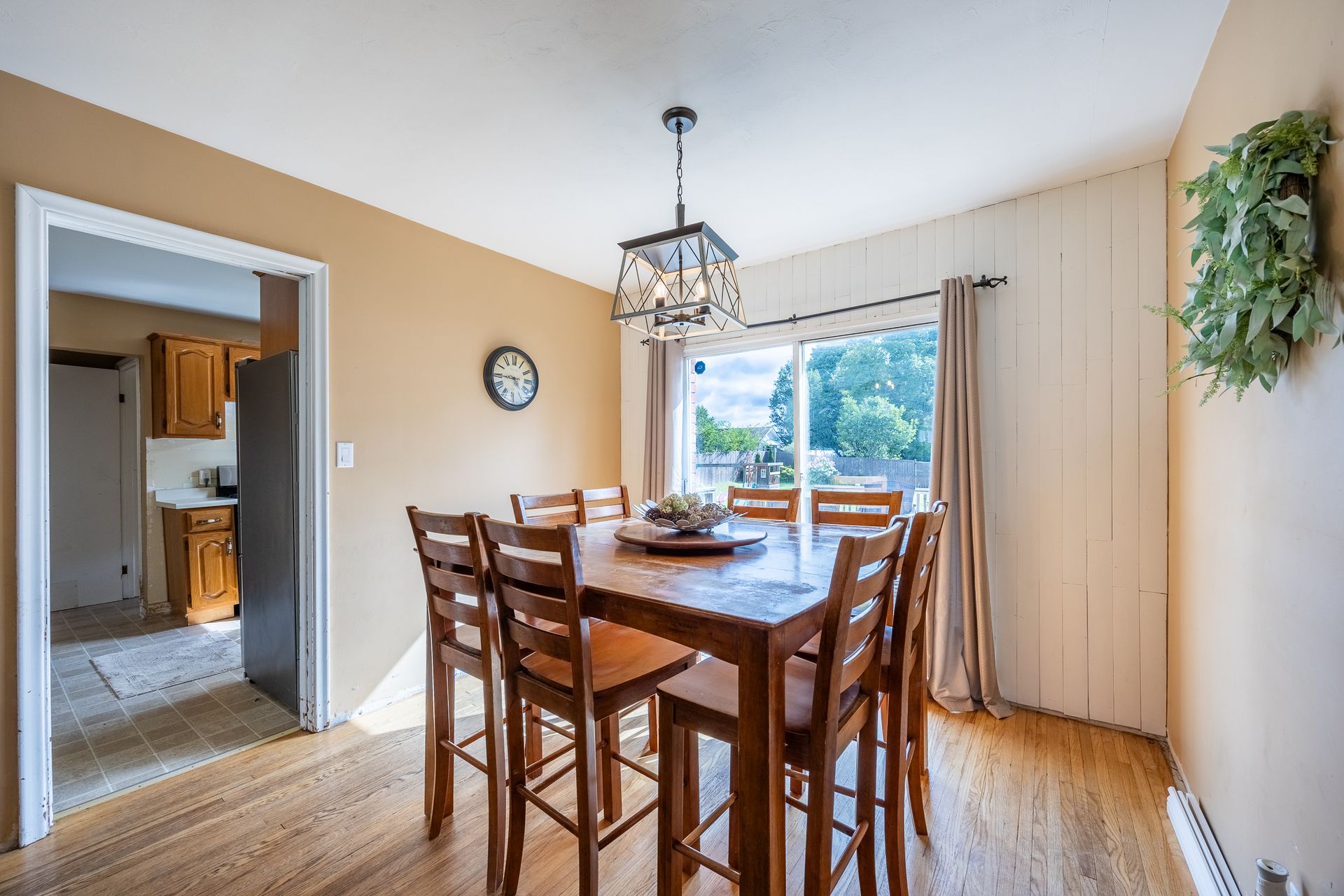 Dining area with wood finished floors, door looking into the back yard at 5 Bint Avenue, Simcoe Dining area with wood finished floors, door looking into the back yard at 5 Bint Avenue, Simcoe