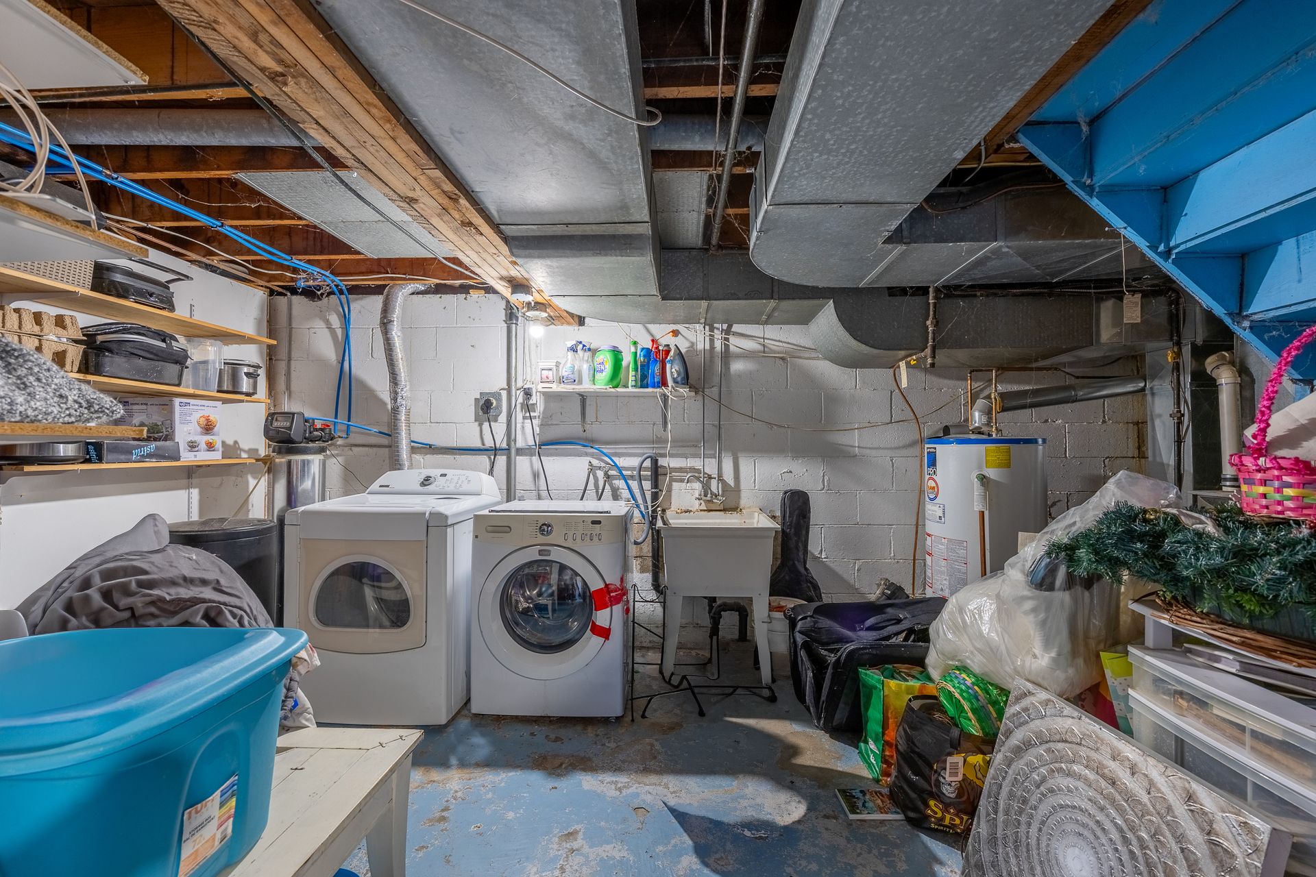 Unfinished basement side with washer and dryer, water heater, sump pump at 5 Bint Avenue, Simcoe Unfinished basement side with washer and dryer, water heater, sump pump at 5 Bint Avenue, Simcoe