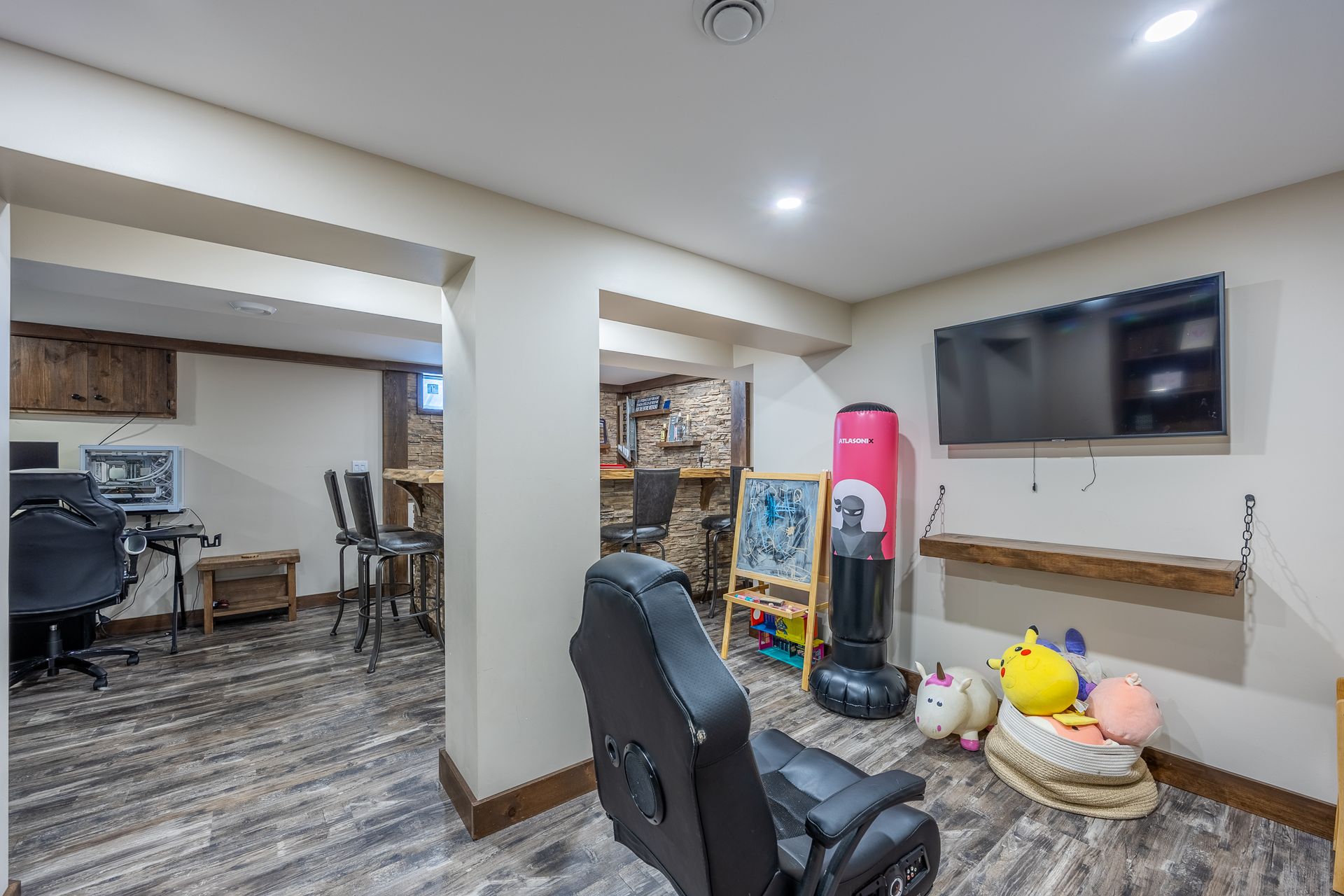 Cinema room with a barn door and electric fireplace at 5 Bint Avenue, Simcoe Cinema room with a barn door and electric fireplace at 5 Bint Avenue, Simcoe