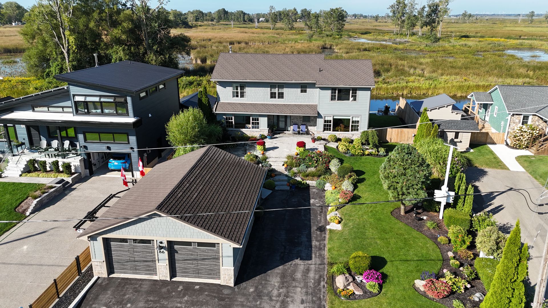 Front view with 2-car garage at 86 Old Cut Boulevard, Long Point Cottage Community, Long Point Front view with 2-car garage at 86 Old Cut Boulevard, Long Point Cottage Community, Long Point