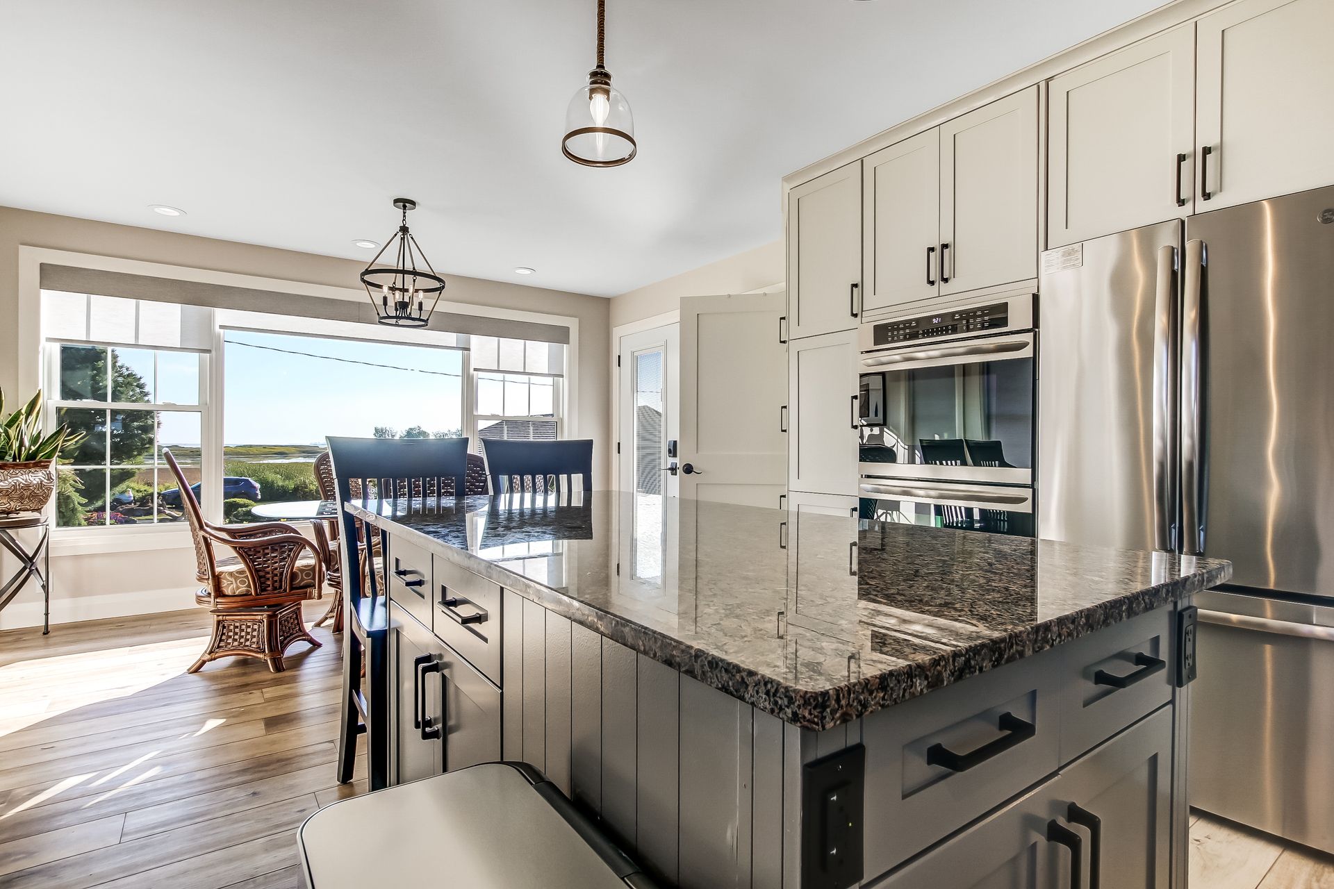 Kitchen island with eating area for quick meals at 86 Old Cut Boulevard, Long Point Cottage Community, Long Point Kitchen island with eating area for quick meals at 86 Old Cut Boulevard, Long Point Cottage Community, Long Point