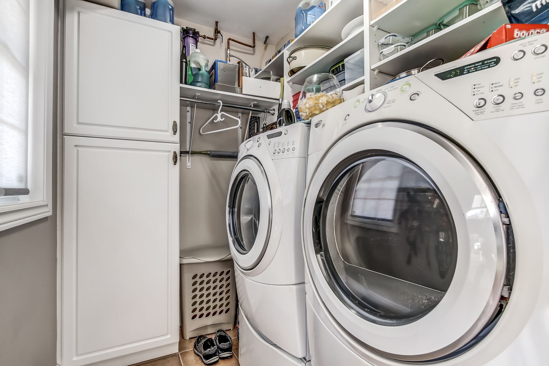Laundry room neatly tucked away off the kitchen at 86 Old Cut Boulevard, Long Point Cottage Community, Long Point Laundry room neatly tucked away off the kitchen at 86 Old Cut Boulevard, Long Point Cottage Community, Long Point