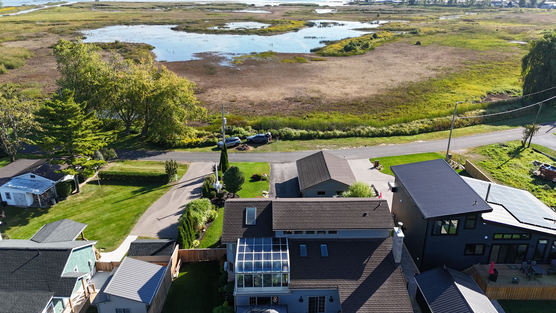 View of back of house showing sunroom at 86 Old Cut Boulevard, Long Point Cottage Community, Long Point View of back of house showing sunroom at 86 Old Cut Boulevard, Long Point Cottage Community, Long Point