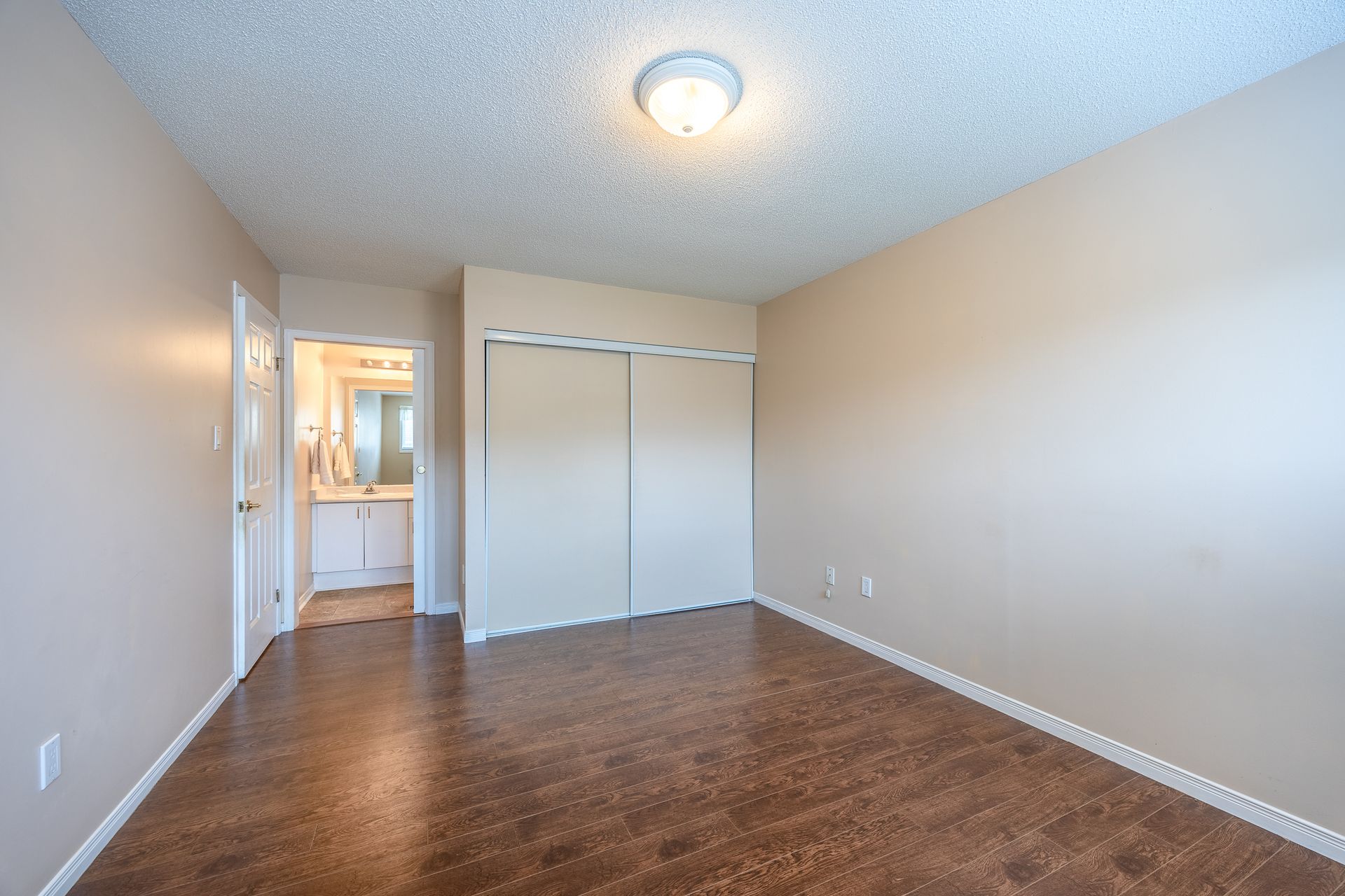 Primary bedroom with closet and en suite at 4 Walsingham Drive, Village of Long Point Bay, Port Rowan Primary bedroom with closet and en suite at 4 Walsingham Drive, Village of Long Point Bay, Port Rowan