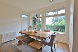 Dining room with backyard views at 828 Britannia Way, Britannia Beach, Squamish
