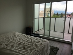 master-bedroom-queen-bed-patio at 509 - 3456 Commercial Drive, Renfrew Heights, Vancouver East