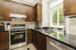 Kitchen - Black granite countertops at 876 West 23rd Avenue, Cambie, Vancouver West Kitchen - Black granite countertops at 876 West 23rd Avenue, Cambie, Vancouver West