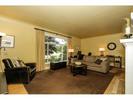 Formal Living room with gas fireplace at 5085 Inverness Street, Fraser VE, Vancouver East