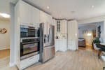 Stainless steel appliances-gas cooktop at 5085 Inverness Street, Fraser VE, Vancouver East