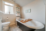 Upstairs bathroom with soak tub at 5085 Inverness Street, Fraser VE, Vancouver East