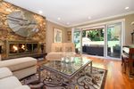Formal Living Room with Gas fireplace and French doors opening to backyard at 3955 Viewridge Place, Bayridge, West Vancouver