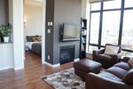 A cozy fireplace and living area at 1606 - 2355 Madison Avenue, Brentwood Park, Burnaby North