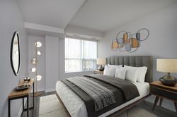 Primary Bedroom Virtually Staged at 212 - 1 Falaise Road, West Hill, Toronto