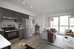 Kitchen & Living Room Virtually Staged at 212 - 1 Falaise Road, West Hill, Toronto