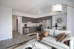 Living Room & Kitchen Virtually Staged at 212 - 1 Falaise Road, West Hill, Toronto