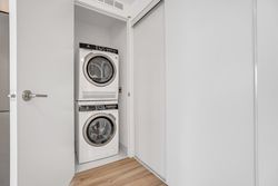 Ensuite Laundry Closet at 410 - 7439 Kingston Road, Rouge E11, Toronto