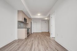 Living Room & Kitchen at 410 - 7439 Kingston Road, Rouge E11, Toronto