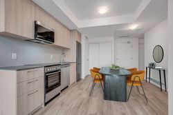 Kitchen & Dining Room Virtually Staged at 410 - 7439 Kingston Road, Rouge E11, Toronto