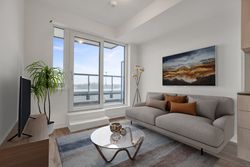 Living Room Virtually Staged at 410 - 7439 Kingston Road, Rouge E11, Toronto