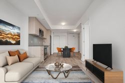 Living Room Virtually Staged at 410 - 7439 Kingston Road, Rouge E11, Toronto