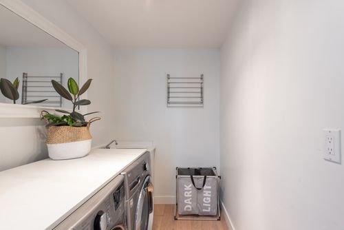 Spacious laundry room with inside door to garage at 383 67a Street, Boundary Beach, Tsawwassen