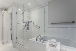 Enclosed toilet closet, glass enclosed shower and soaker tub in master ensuite bath at 708 - 4685 Valley Drive, Quilchena, Vancouver West