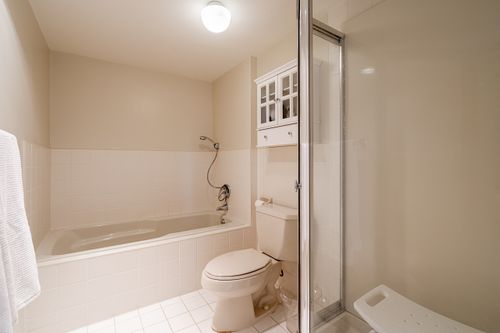 Ensuite - tub & stall shower enclosure at 301 - 2203 Bellevue Avenue, Dundarave, West Vancouver