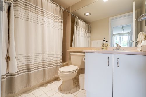 Guest bathroom off the hallway at 301 - 2203 Bellevue Avenue, Dundarave, West Vancouver