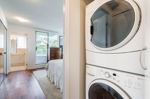 Ensuite laundry at entrance to primary bedroom at 301 - 2203 Bellevue Avenue, Dundarave, West Vancouver