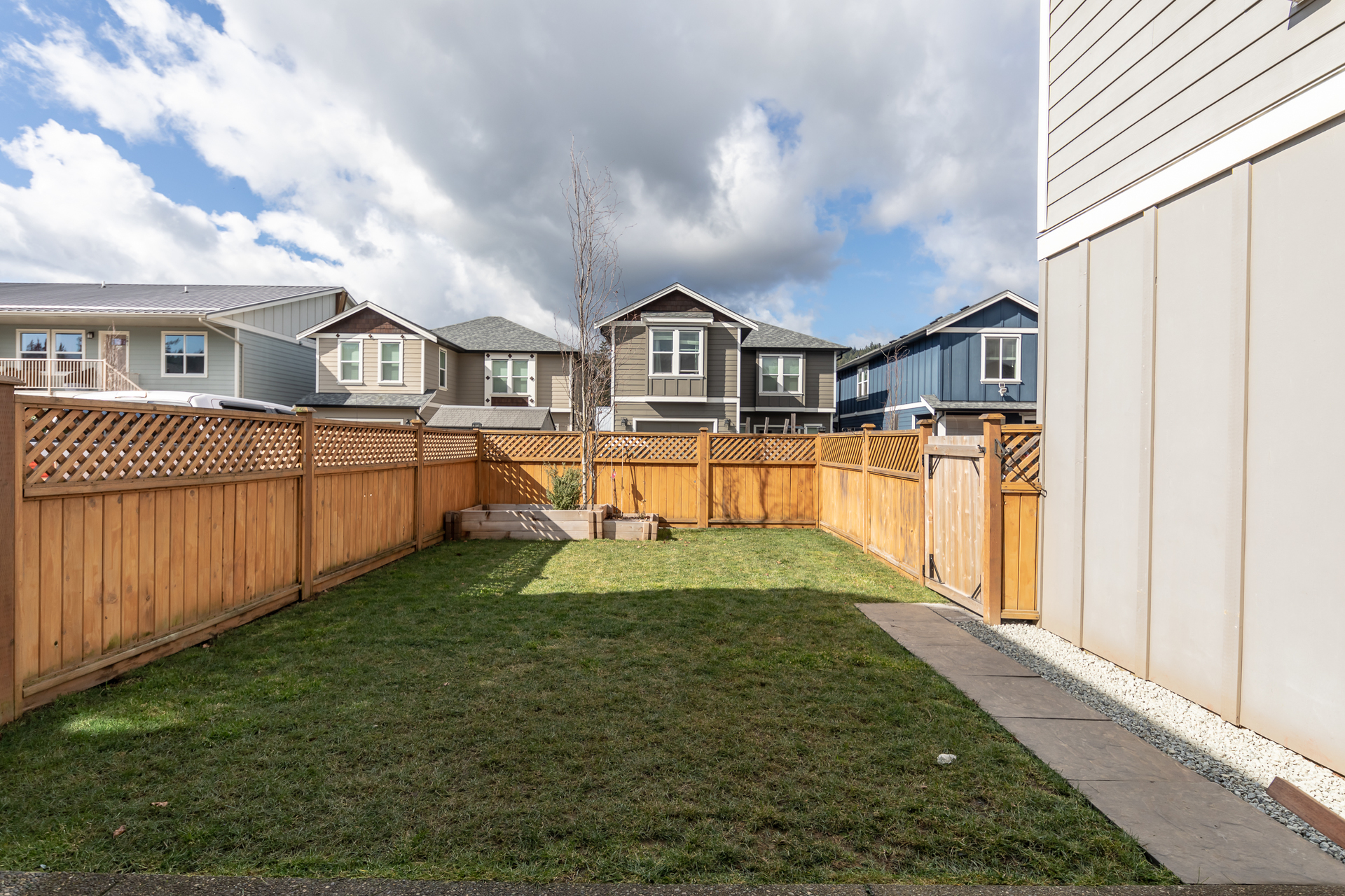 Fenced Yard With Underground Sprinklers at 3288 Merlin Road, Happy Valley, Langford Fenced Yard With Underground Sprinklers at 3288 Merlin Road, Happy Valley, Langford