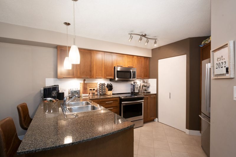 031 at 409 - 19677 Meadow Gardens Way, North Meadows PI, Pitt Meadows