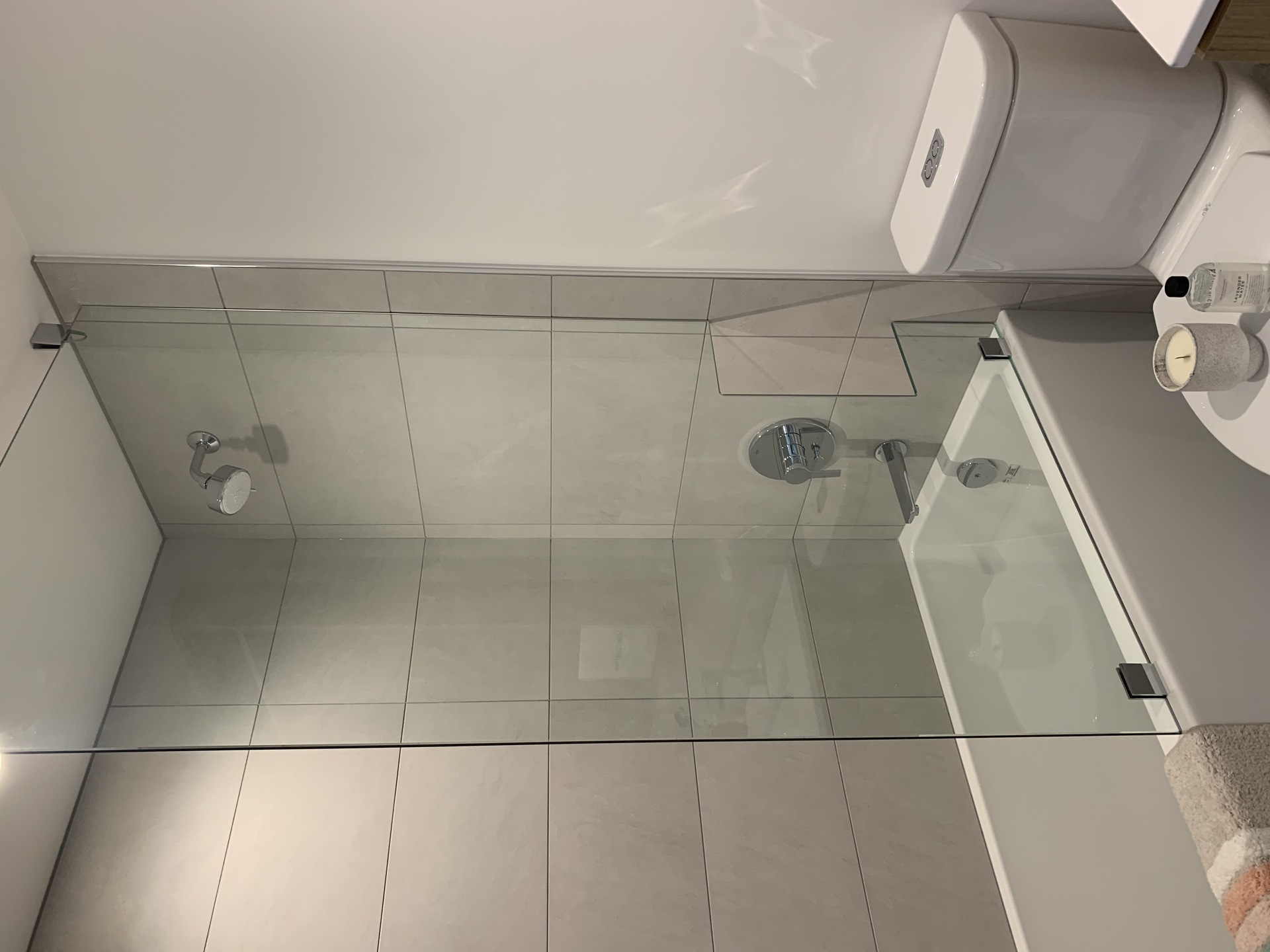 Kin - main bathroom standard glass shower enclosure above tub at 7470 Buller Avenue, Metrotown, Burnaby South Kin - main bathroom standard glass shower enclosure above tub at 7470 Buller Avenue, Metrotown, Burnaby South