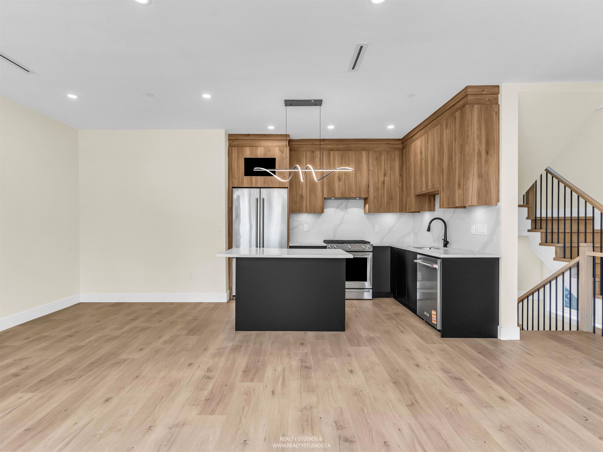 Kitchen with dining area to the side at 1 - 5221 Clarendon Street, Collingwood VE, Vancouver East Kitchen with dining area to the side at 1 - 5221 Clarendon Street, Collingwood VE, Vancouver East