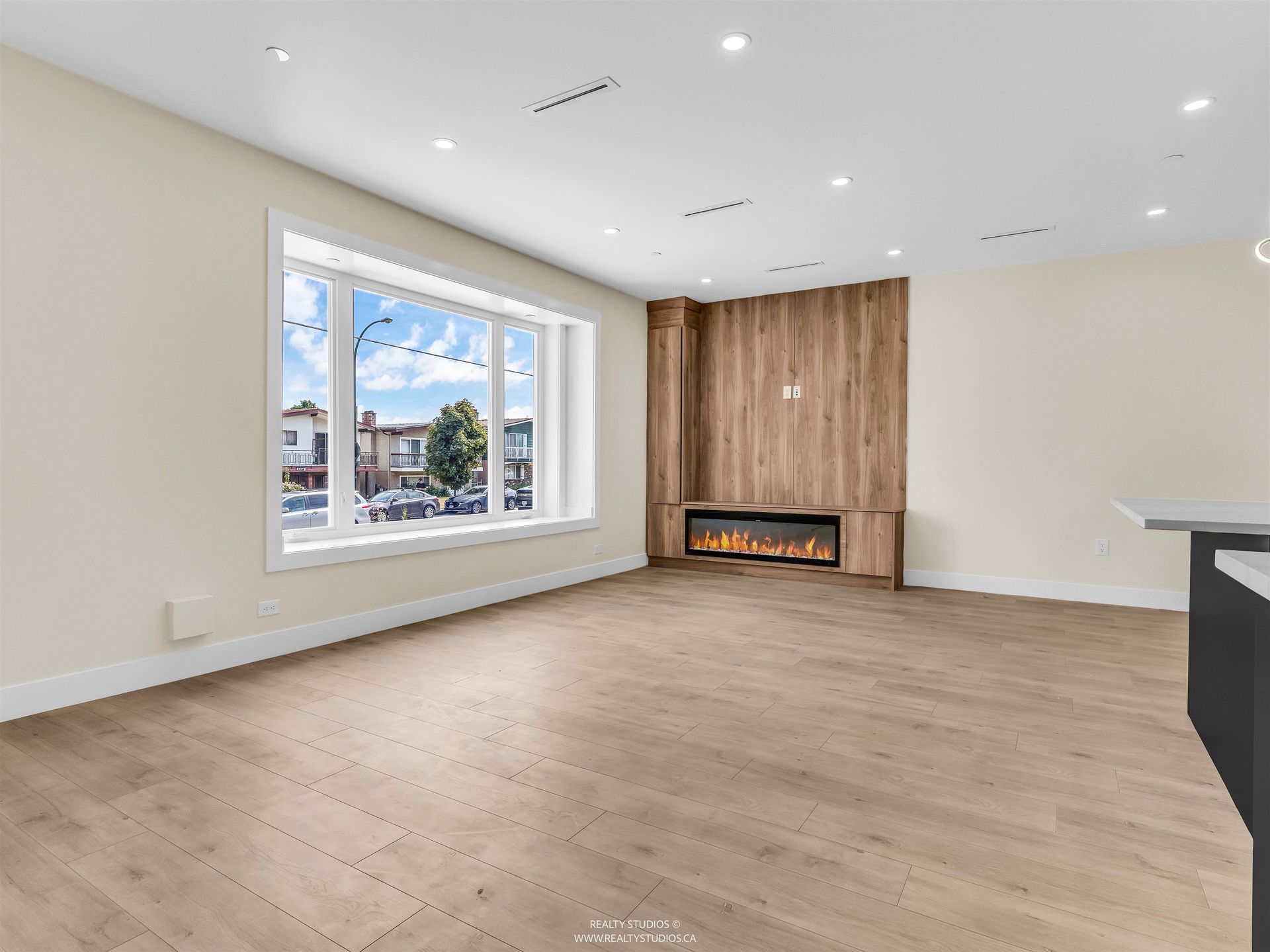 Living area with fireplace at 1 - 5221 Clarendon Street, Collingwood VE, Vancouver East Living area with fireplace at 1 - 5221 Clarendon Street, Collingwood VE, Vancouver East