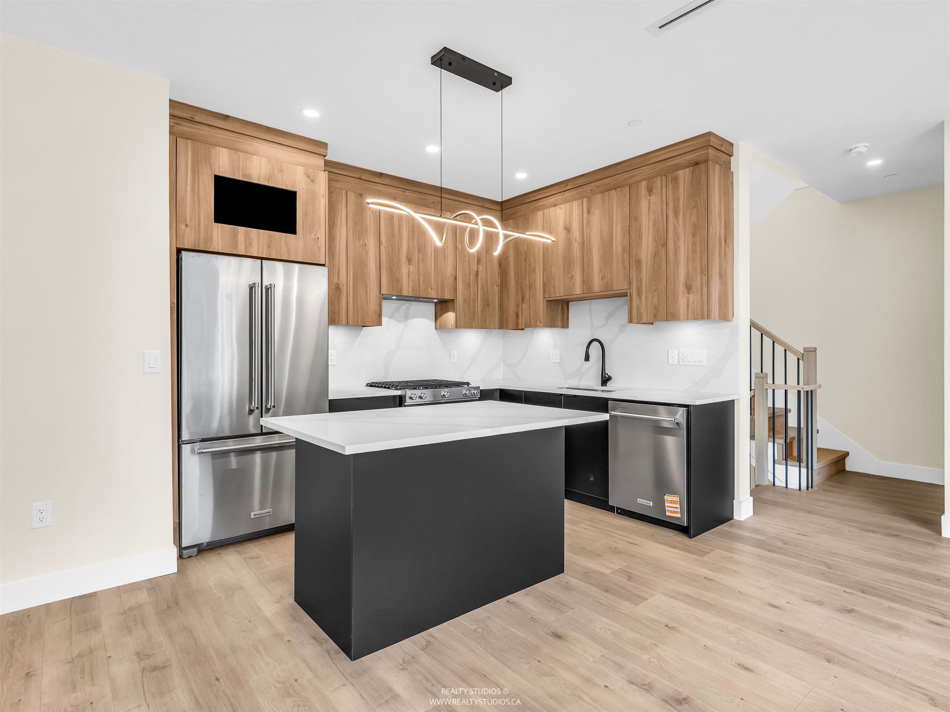 Kitchen with Kitchen Aid appliances at 1 - 5221 Clarendon Street, Collingwood VE, Vancouver East Kitchen with Kitchen Aid appliances at 1 - 5221 Clarendon Street, Collingwood VE, Vancouver East