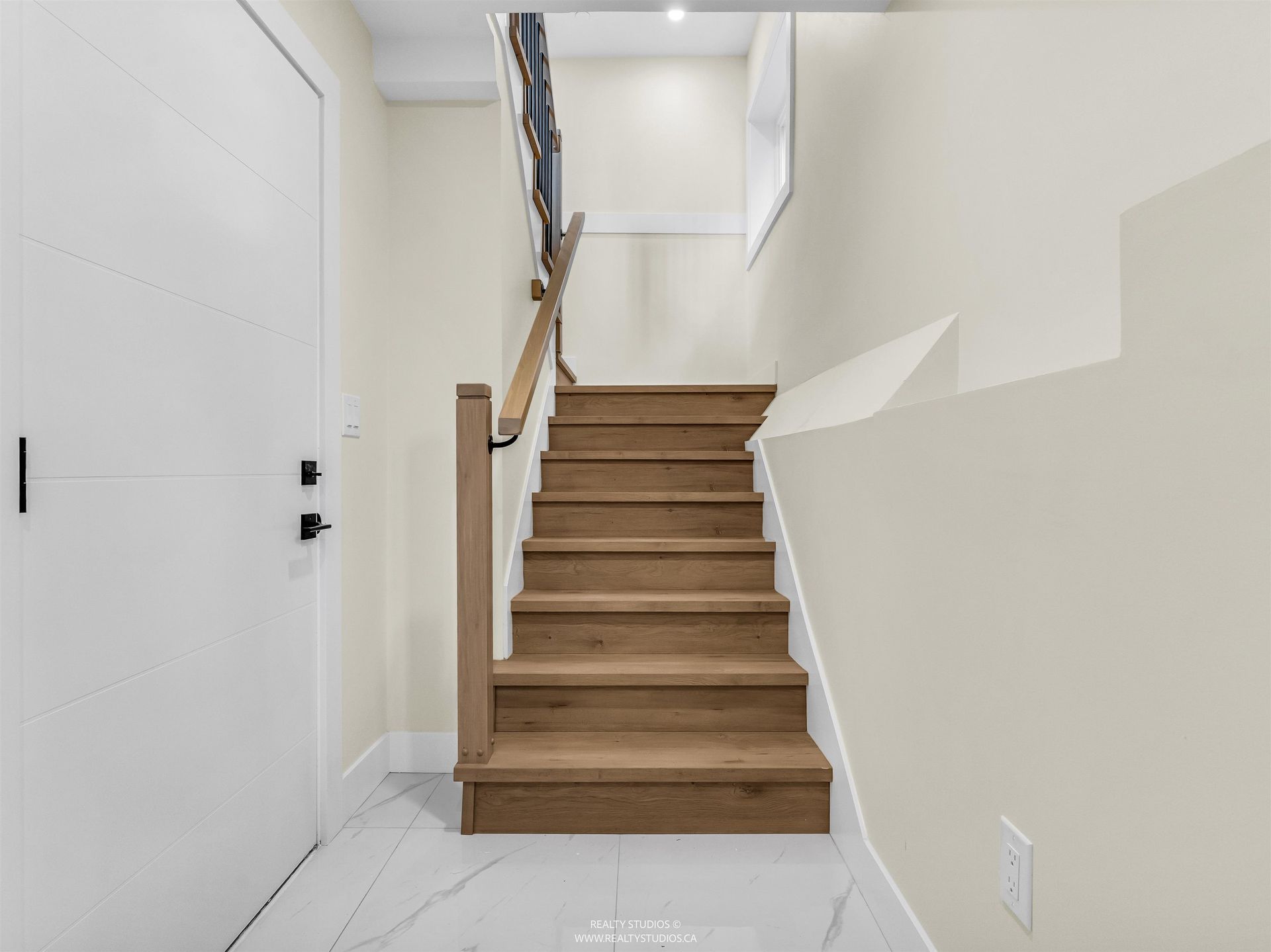 Stairs to garage and laundry/flex area at 1 - 5221 Clarendon Street, Collingwood VE, Vancouver East Stairs to garage and laundry/flex area at 1 - 5221 Clarendon Street, Collingwood VE, Vancouver East