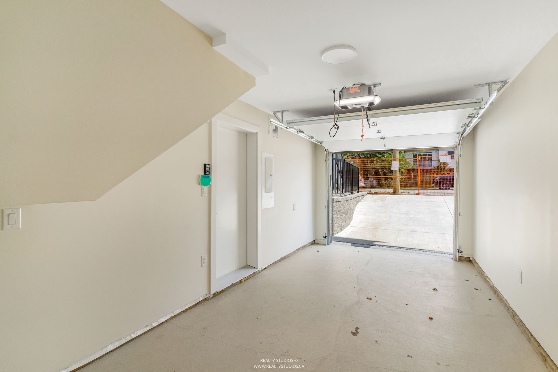 Garage with EV  at 1 - 5221 Clarendon Street, Collingwood VE, Vancouver East Garage with EV  at 1 - 5221 Clarendon Street, Collingwood VE, Vancouver East
