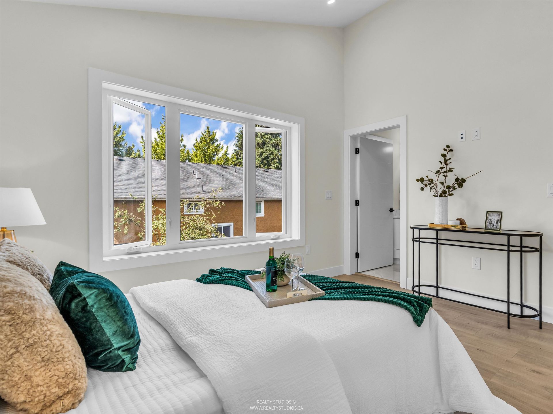Primary bedroom with mountain views at 2 - 5221 Clarendon Street, Collingwood VE, Vancouver East Primary bedroom with mountain views at 2 - 5221 Clarendon Street, Collingwood VE, Vancouver East
