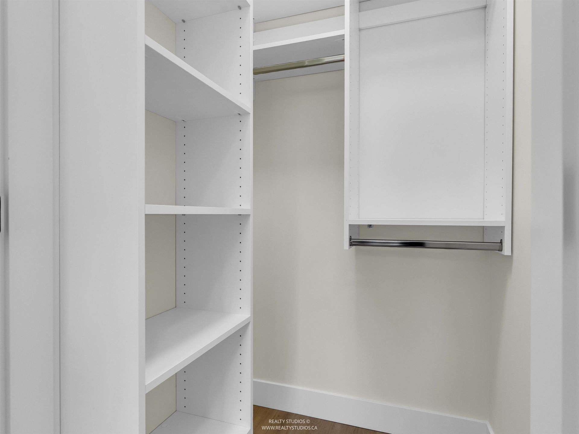 Walk-in closet in bedroom 2 at 2 - 5221 Clarendon Street, Collingwood VE, Vancouver East Walk-in closet in bedroom 2 at 2 - 5221 Clarendon Street, Collingwood VE, Vancouver East