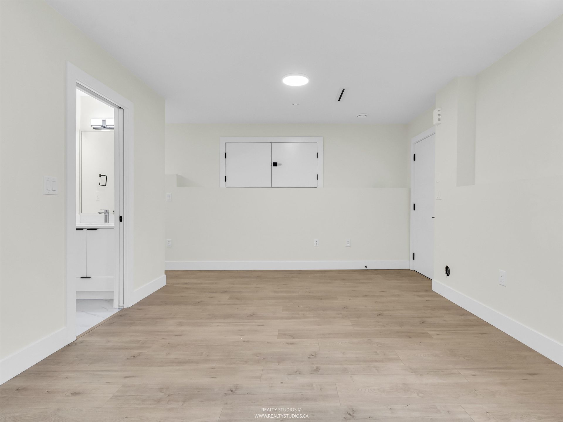 Rec room with crawl space storage at 2 - 5221 Clarendon Street, Collingwood VE, Vancouver East Rec room with crawl space storage at 2 - 5221 Clarendon Street, Collingwood VE, Vancouver East