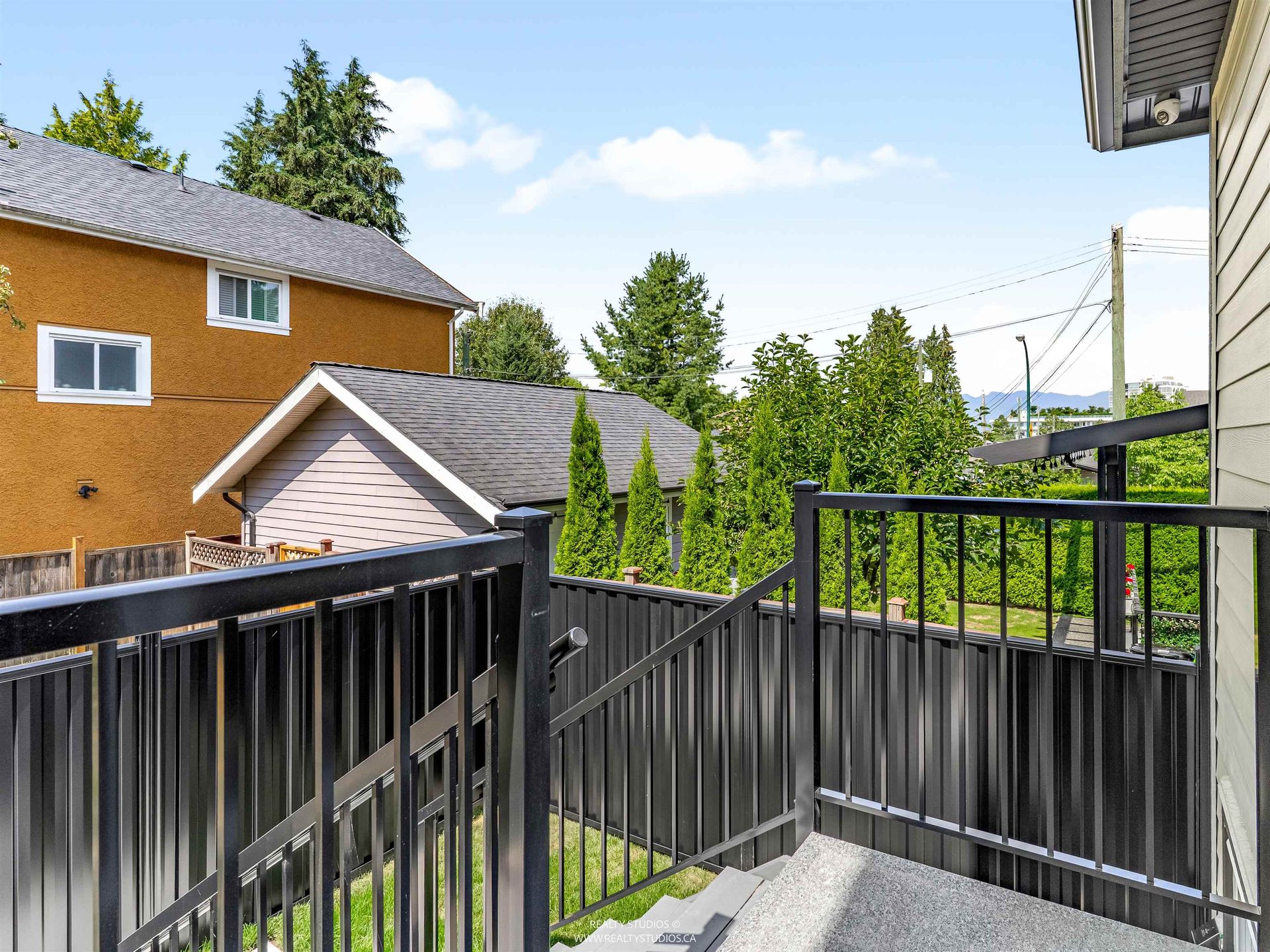 Porch off dining area with mountain view at 2 - 5221 Clarendon Street, Collingwood VE, Vancouver East Porch off dining area with mountain view at 2 - 5221 Clarendon Street, Collingwood VE, Vancouver East