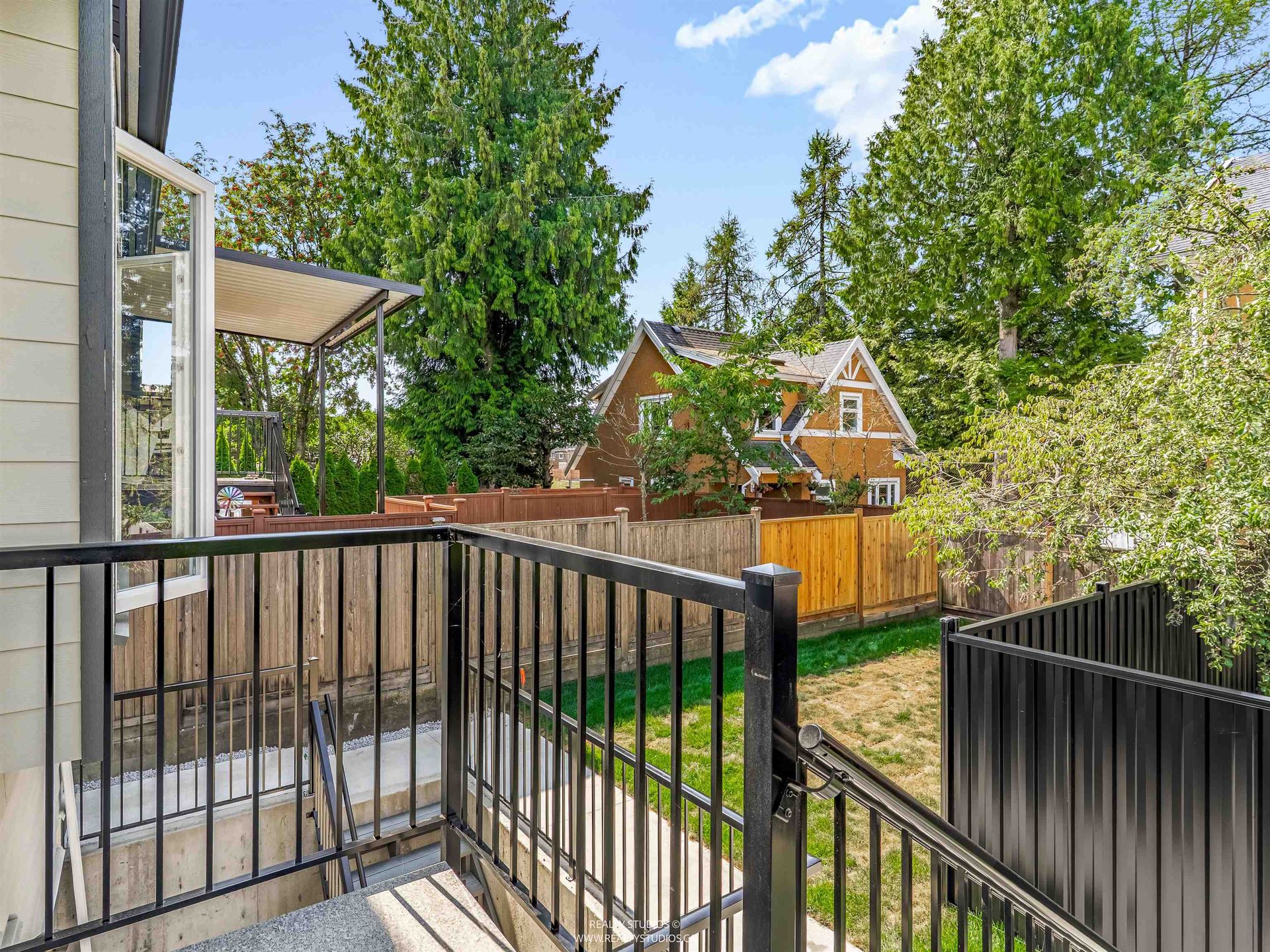 Porch looking towards garden at 2 - 5221 Clarendon Street, Collingwood VE, Vancouver East Porch looking towards garden at 2 - 5221 Clarendon Street, Collingwood VE, Vancouver East