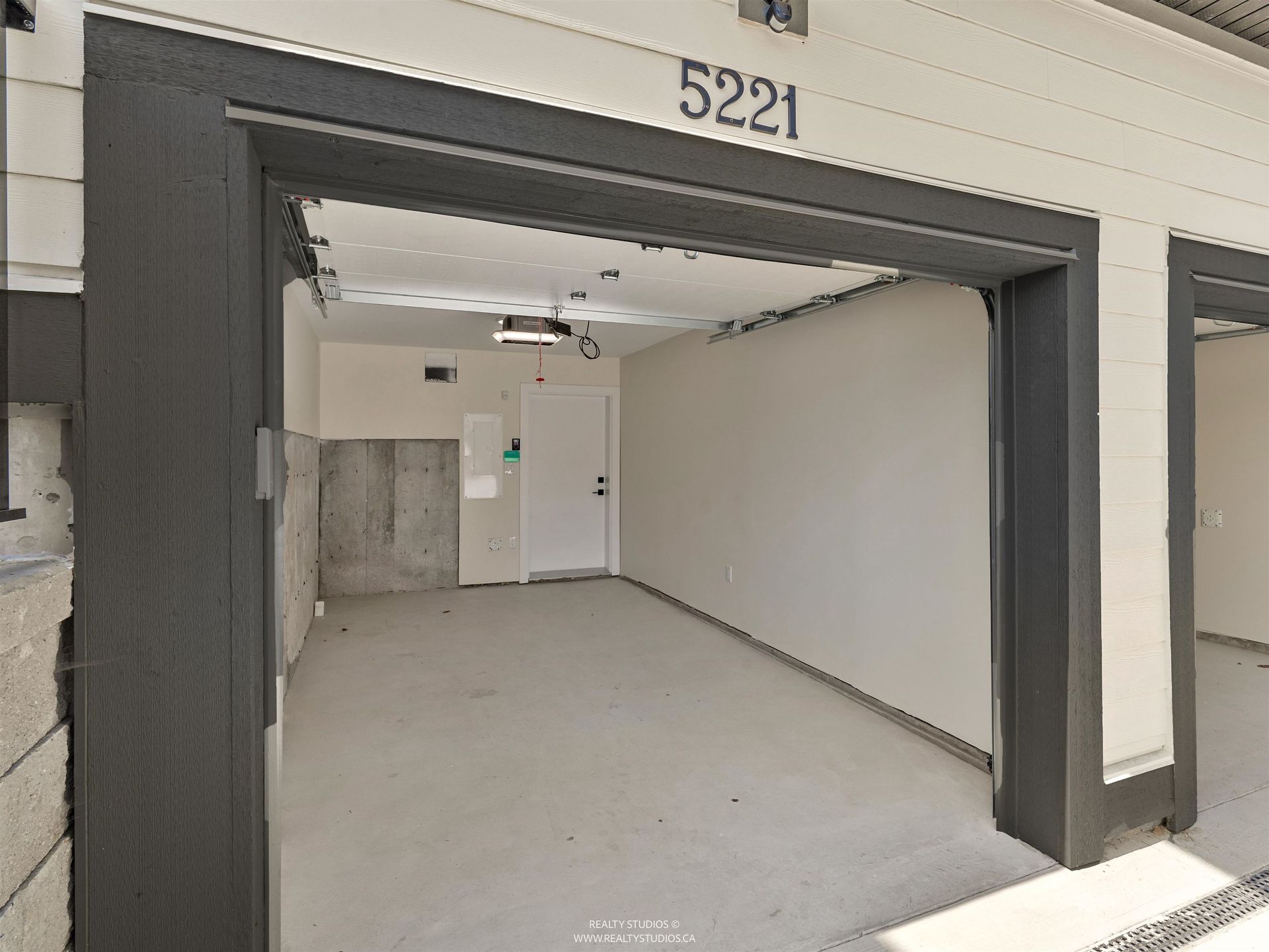 Garage with EV at 2 - 5221 Clarendon Street, Collingwood VE, Vancouver East Garage with EV at 2 - 5221 Clarendon Street, Collingwood VE, Vancouver East