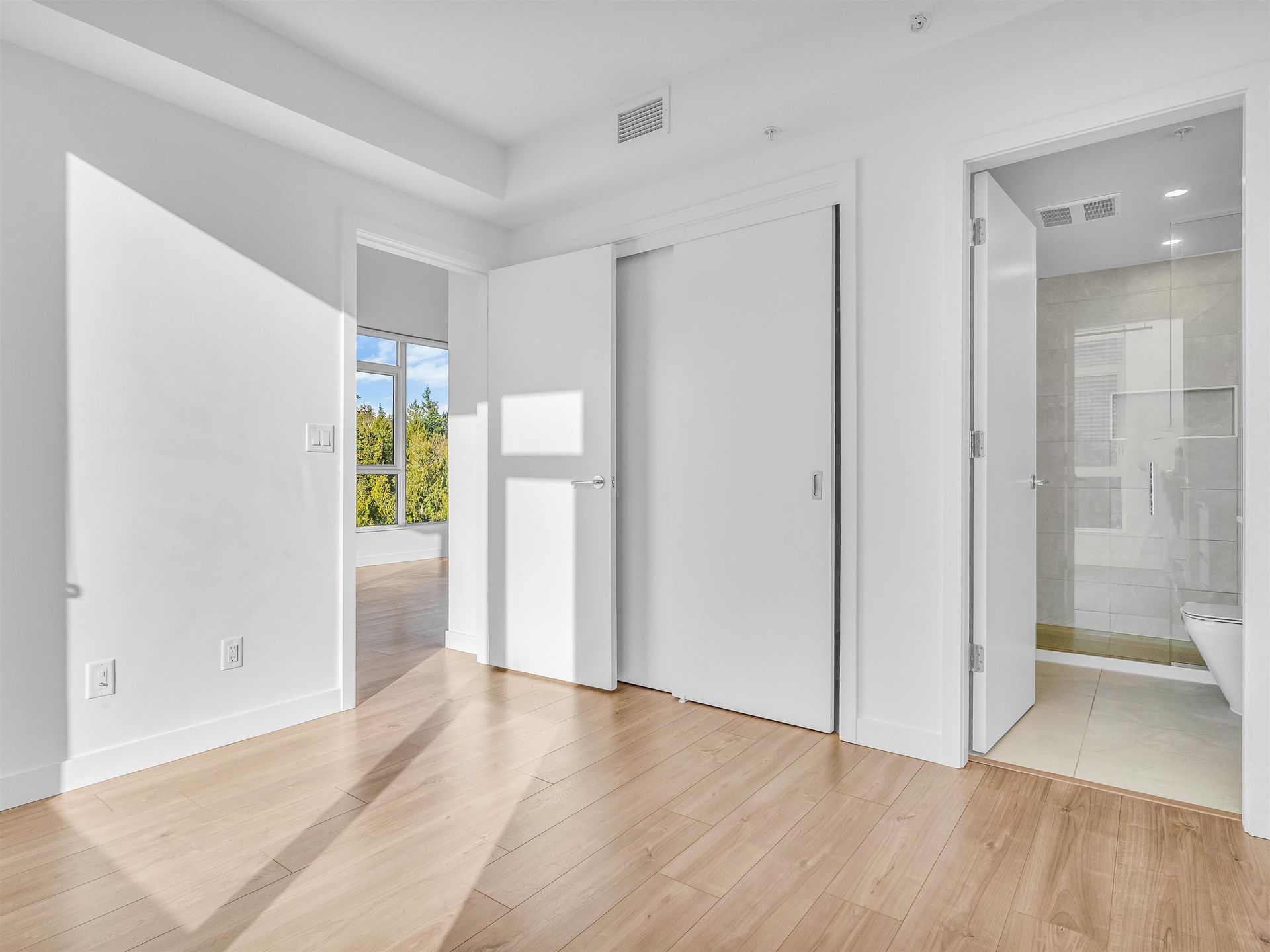 primary bedroom with built in closet millwork at 1208 - 595 Austin Avenue, Coquitlam West, Coquitlam primary bedroom with built in closet millwork at 1208 - 595 Austin Avenue, Coquitlam West, Coquitlam