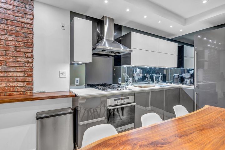 Open Kitchen with Stainless Appliances in Heritage Building at 305 - 12 Water Street, Downtown VW, Vancouver West