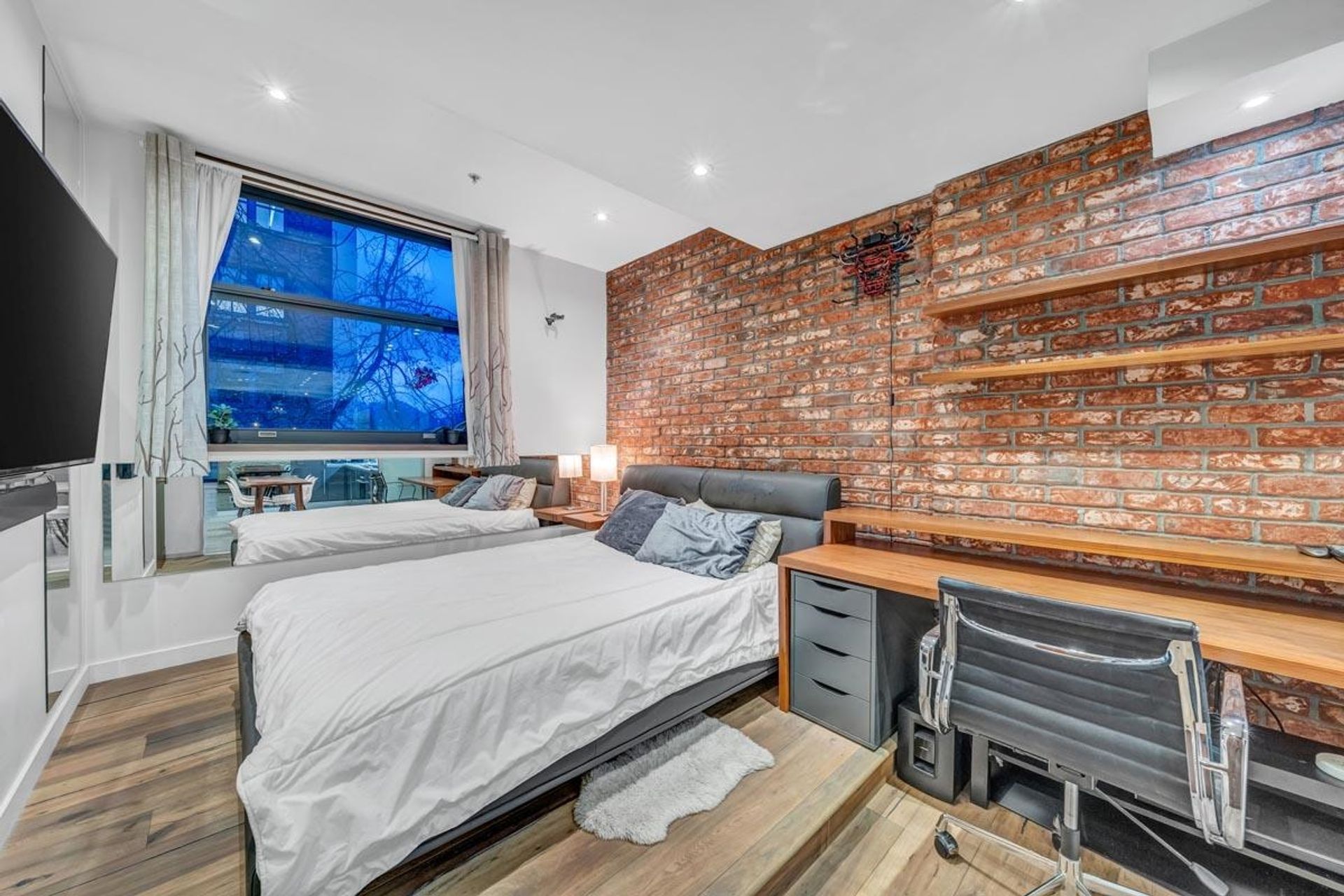 Cozy Urban Bedroom with Brick Wall Accents at 305 - 12 Water Street, Downtown VW, Vancouver West