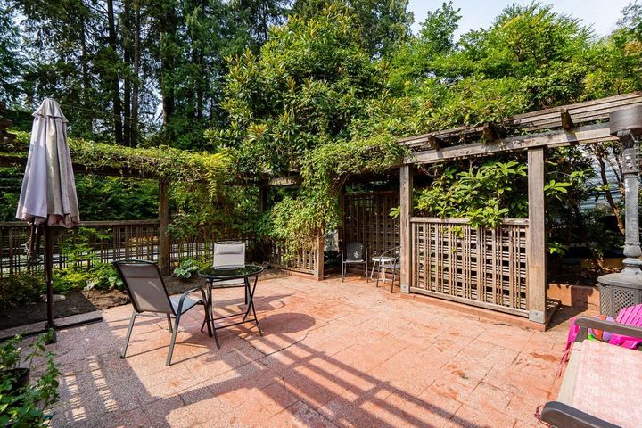 West Coast style exterior surrounded by trees in quiet Riverside community at 1184 Riverside Drive, Seymour NV, North Vancouver