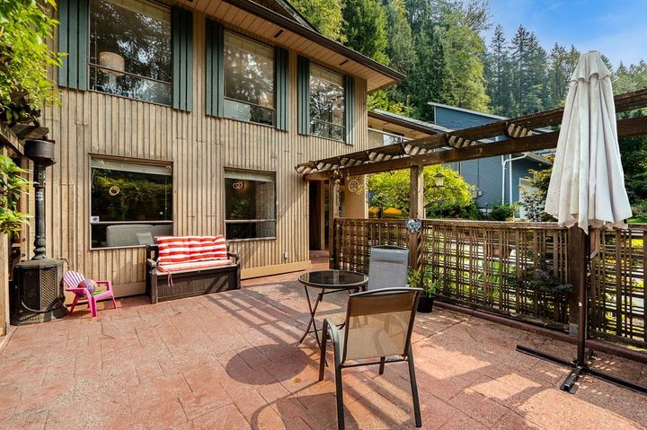 Custom-built home at 1184 Riverside Drive with natural privacy and forest backdrop at 1184 Riverside Drive, Seymour NV, North Vancouver