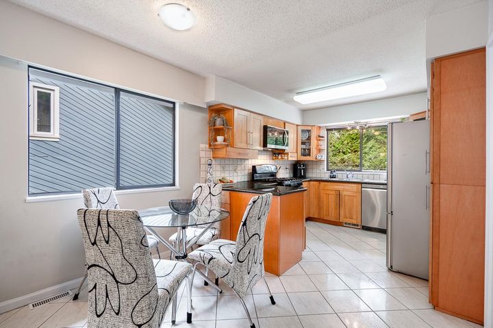 Open kitchen and dining layout perfect for family gatherings in North Vancouver at 1184 Riverside Drive, Seymour NV, North Vancouver