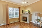 living-rm-w-fireplace at #106 - 15298 20 Avenue, King George Corridor, South Surrey White Rock